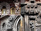 Kathmandu Patan Golden Temple 02 Statues and Carvings Above and To The Side Of The Entrance Door Towards Inner Courtyard 